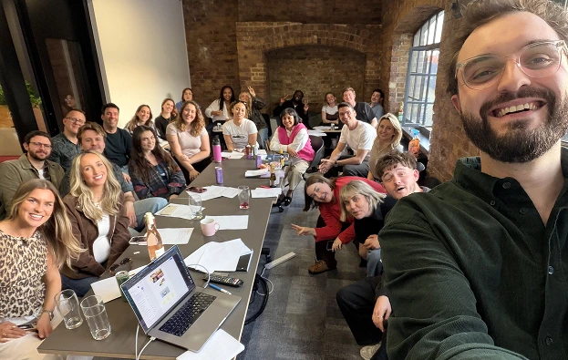 Selfie taken during a Vidsy all-hands meeting with the team seated around laptops