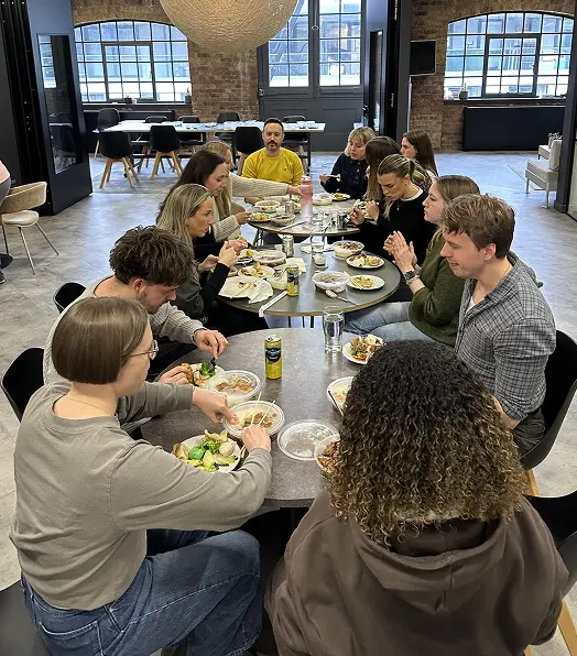 Overhead view of the Vidsy team sharing a long communal lunch at the studio